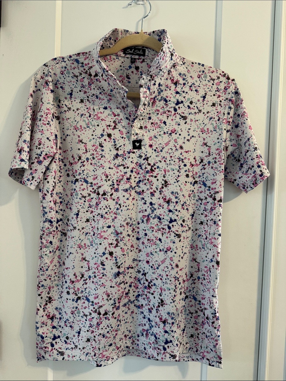 Bad Birdie White Short Sleeve Polo with Pink, Blue, and Black Splatter